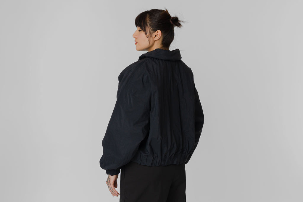 Women's New Balance Casaca Woven Bomber - WJ61D8YX_BK - Lust México